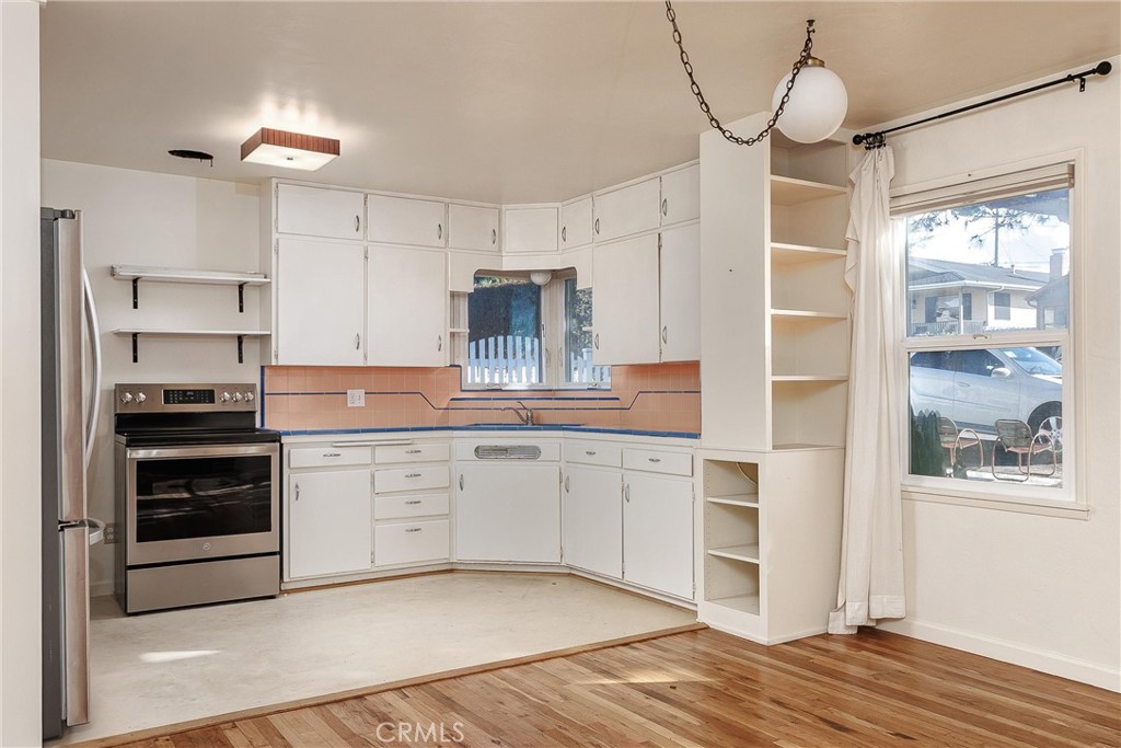943 Pecho Street Morro Bay, CA 93442 - Photo 8 of 19 a kitchen with stainless steel appliances a stove refrigerator and cabinets
