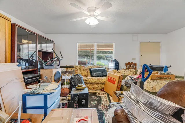 a room with furniture a chandelier and a dining table