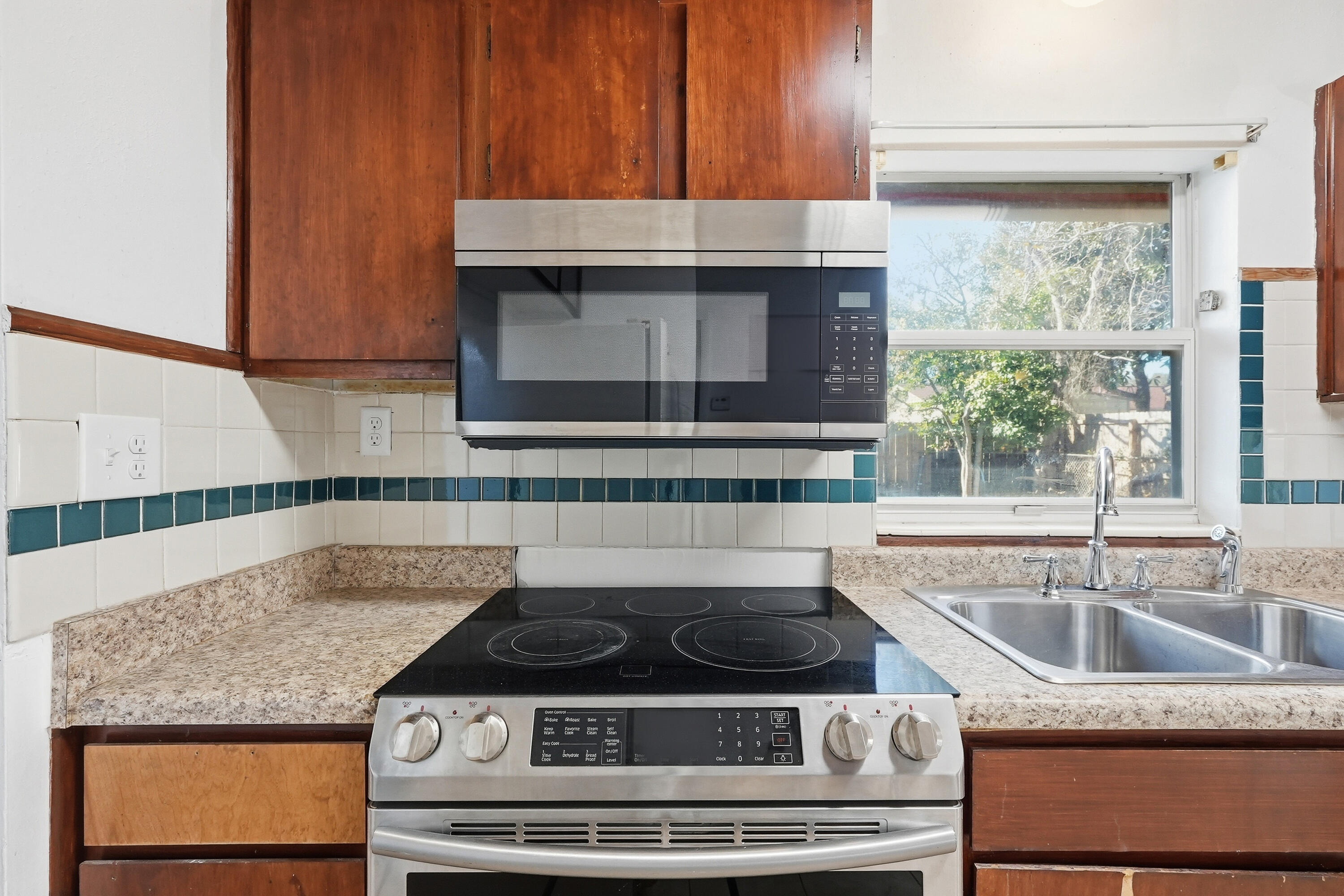 63 Oak Lane Shalimar, FL 32579 - Photo 17 of 42 a stove top oven sitting inside of a kitchen