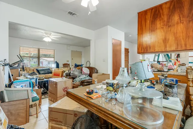 a storage utility room with sink dryer and washer