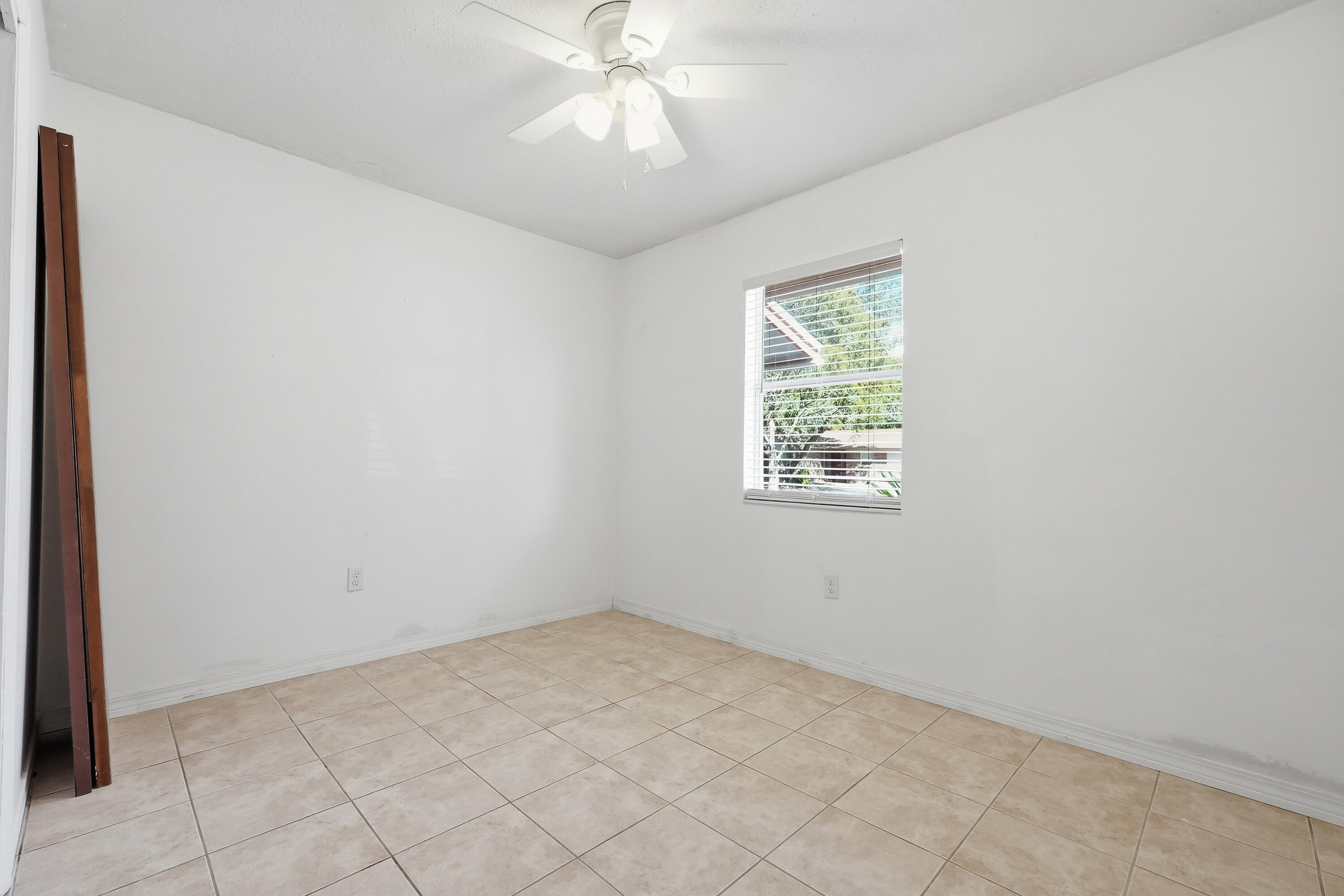 63 Oak Lane Shalimar, FL 32579 - Photo 21 of 42 an empty room with a window