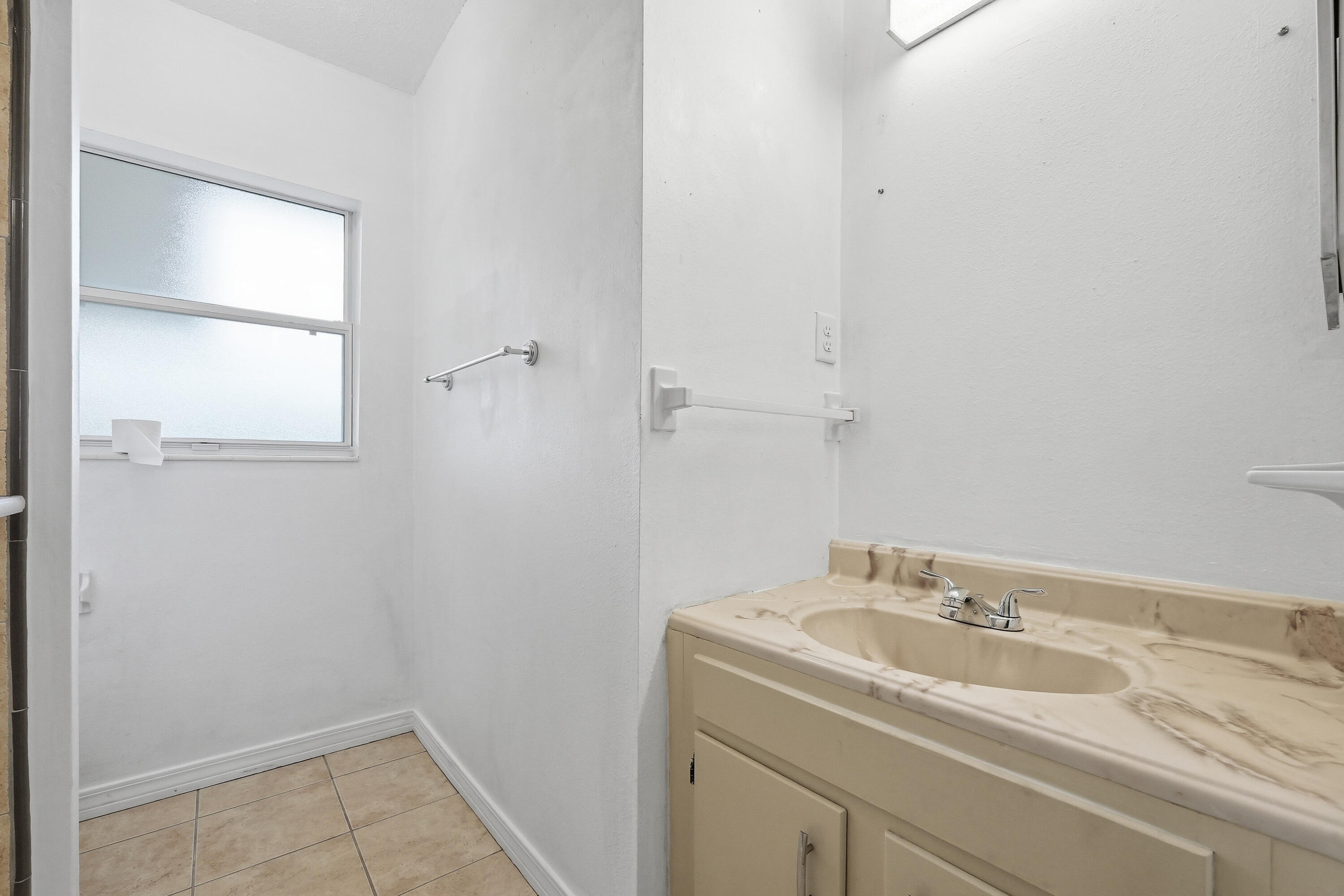 63 Oak Lane Shalimar, FL 32579 - Photo 23 of 42 a bathroom with a sink and a vanity