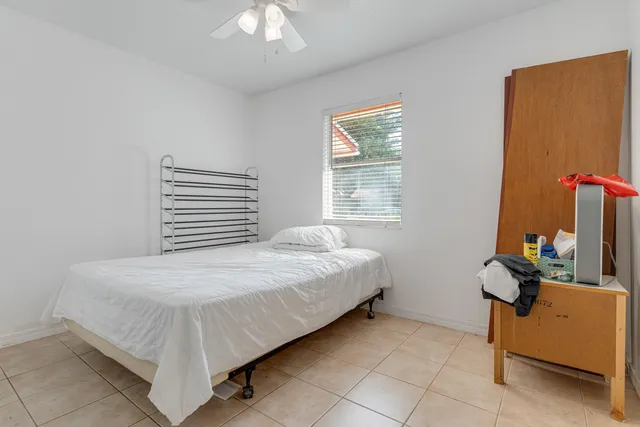 a bedroom with a bed and a closet