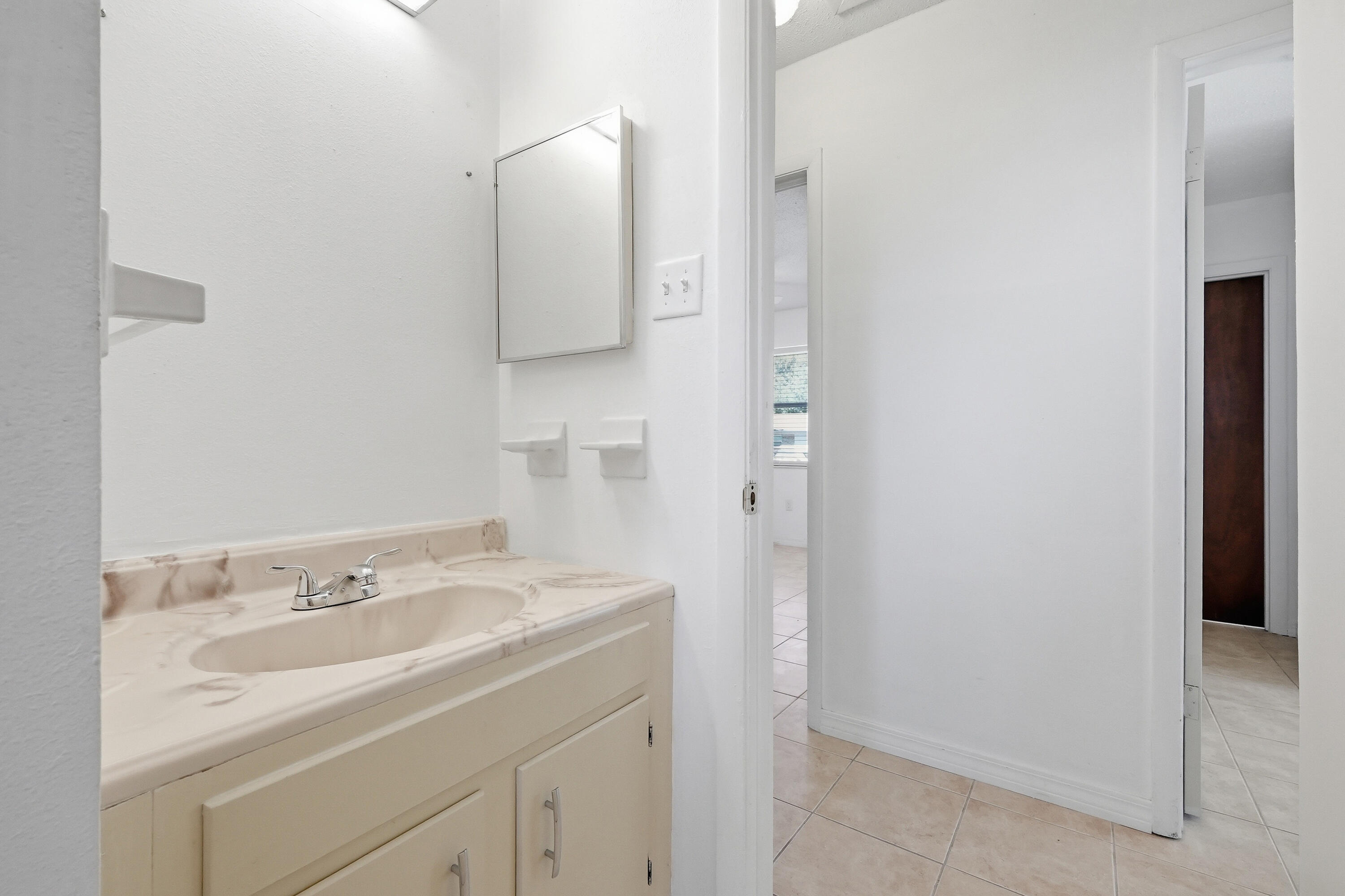 63 Oak Lane Shalimar, FL 32579 - Photo 25 of 42 a bathroom with a sink and a mirror