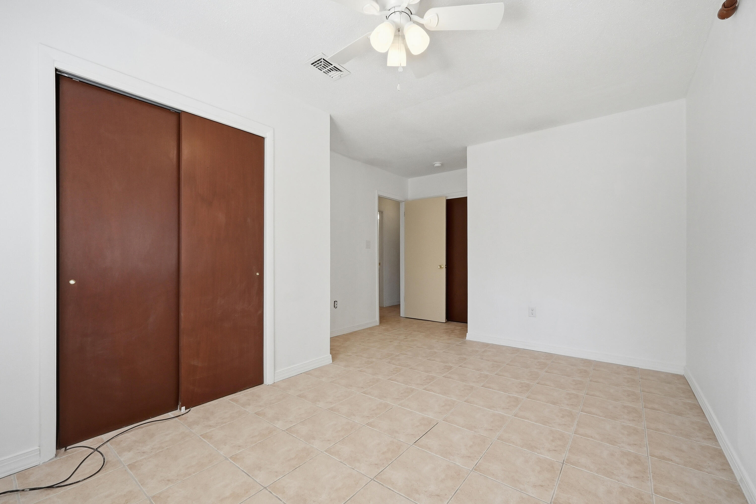 63 Oak Lane Shalimar, FL 32579 - Photo 28 of 42 a view of an empty room with a chandelier fan