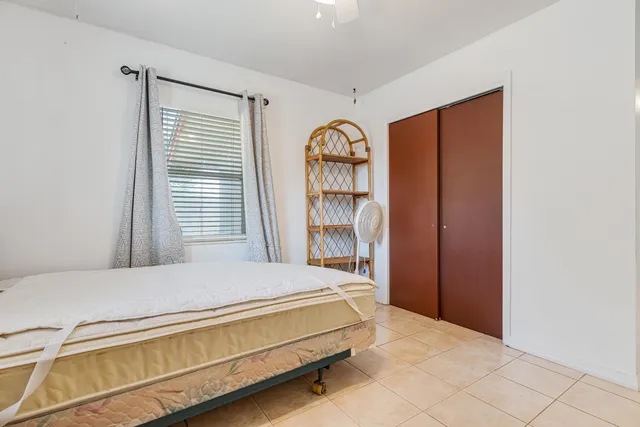 a view of room with gym equipment and a window