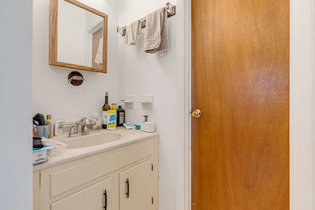 a view of a livingroom with furniture and a window