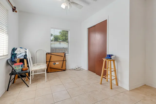 a view of a livingroom with furniture and a window