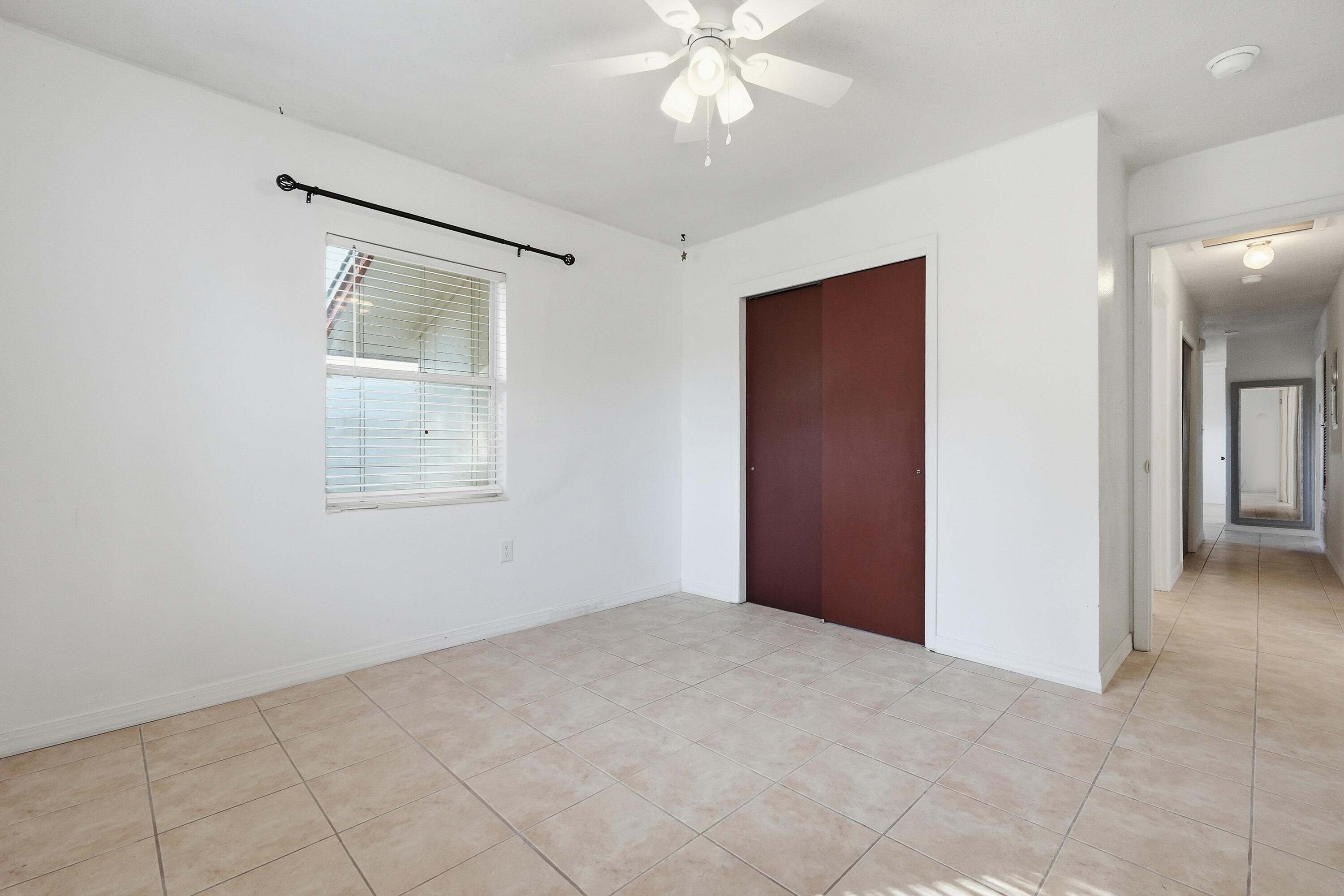 63 Oak Lane Shalimar, FL 32579 - Photo 31 of 42 an empty room with fan and windows