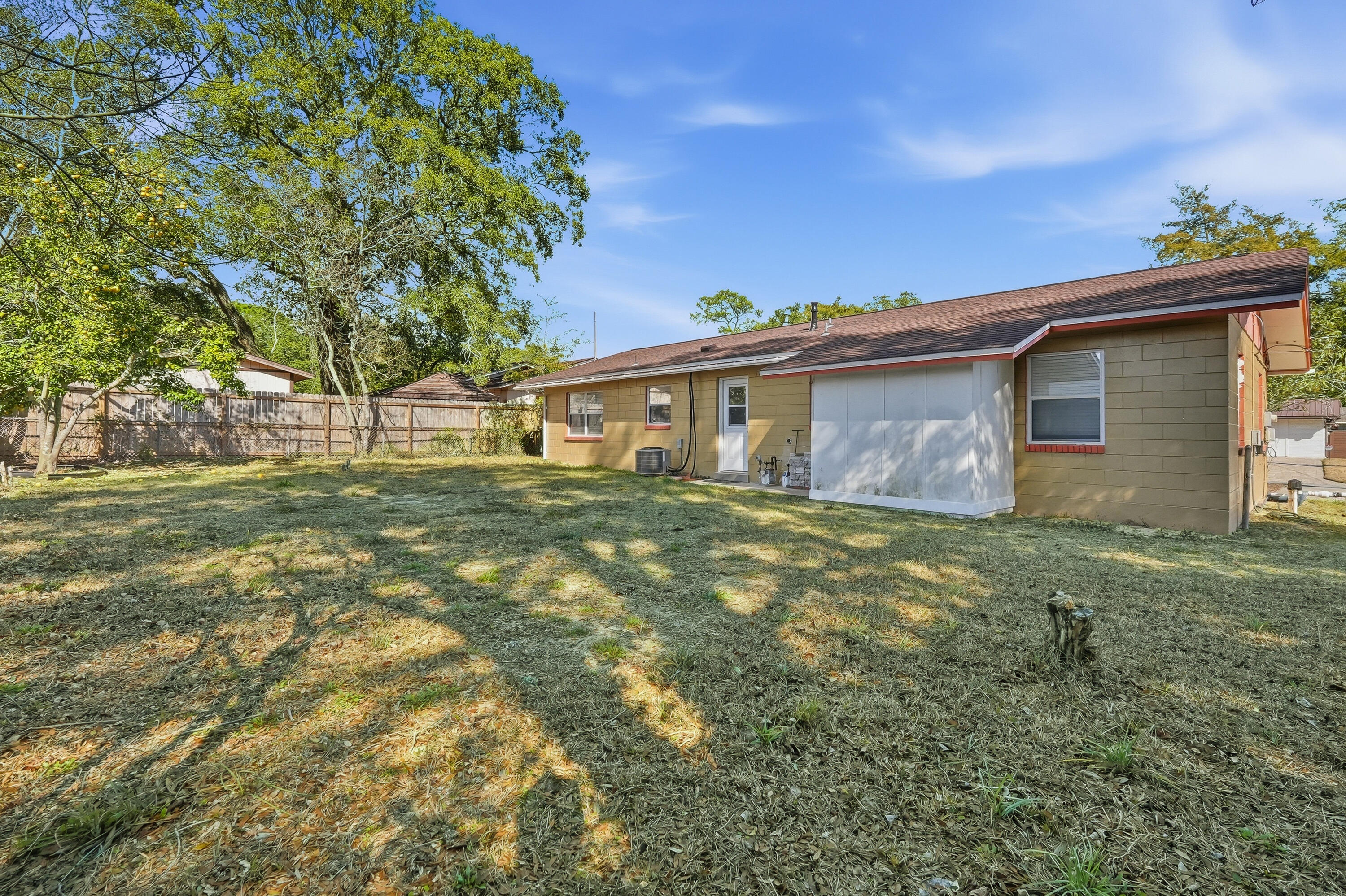 63 Oak Lane Shalimar, FL 32579 - Photo 37 of 42 a front view of a house with a garden