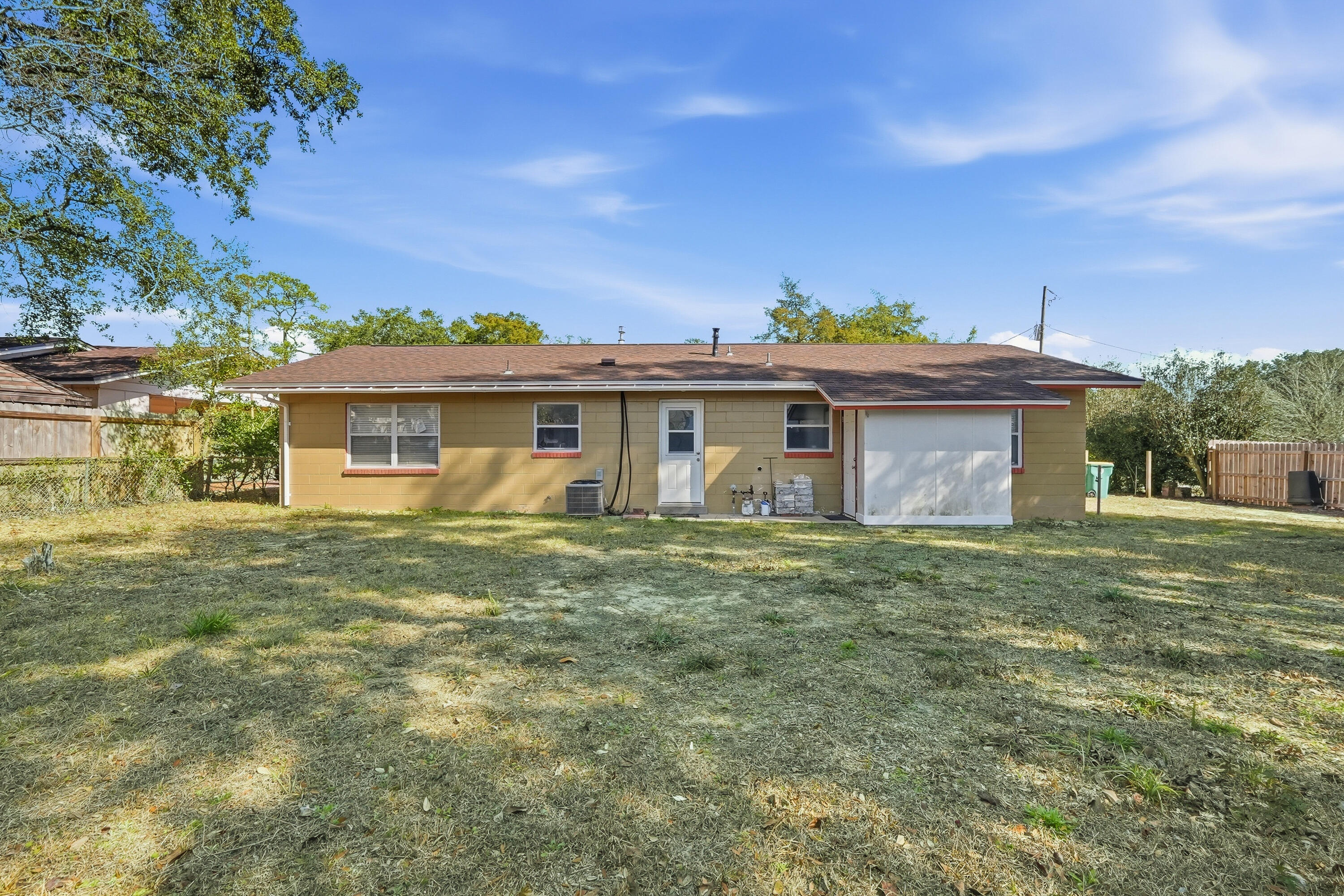 63 Oak Lane Shalimar, FL 32579 - Photo 38 of 42 a front view of a house with a garden
