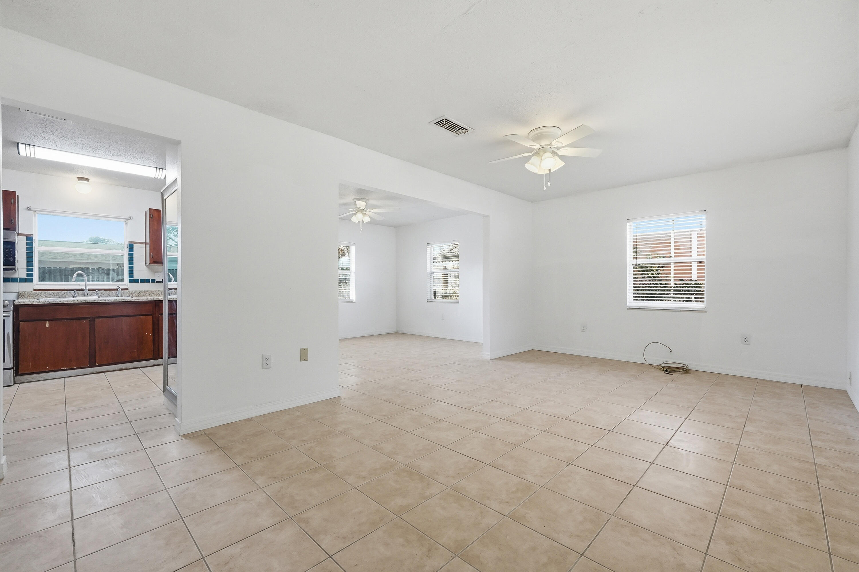 63 Oak Lane Shalimar, FL 32579 - Photo 4 of 42 a view of an empty room with a kitchen
