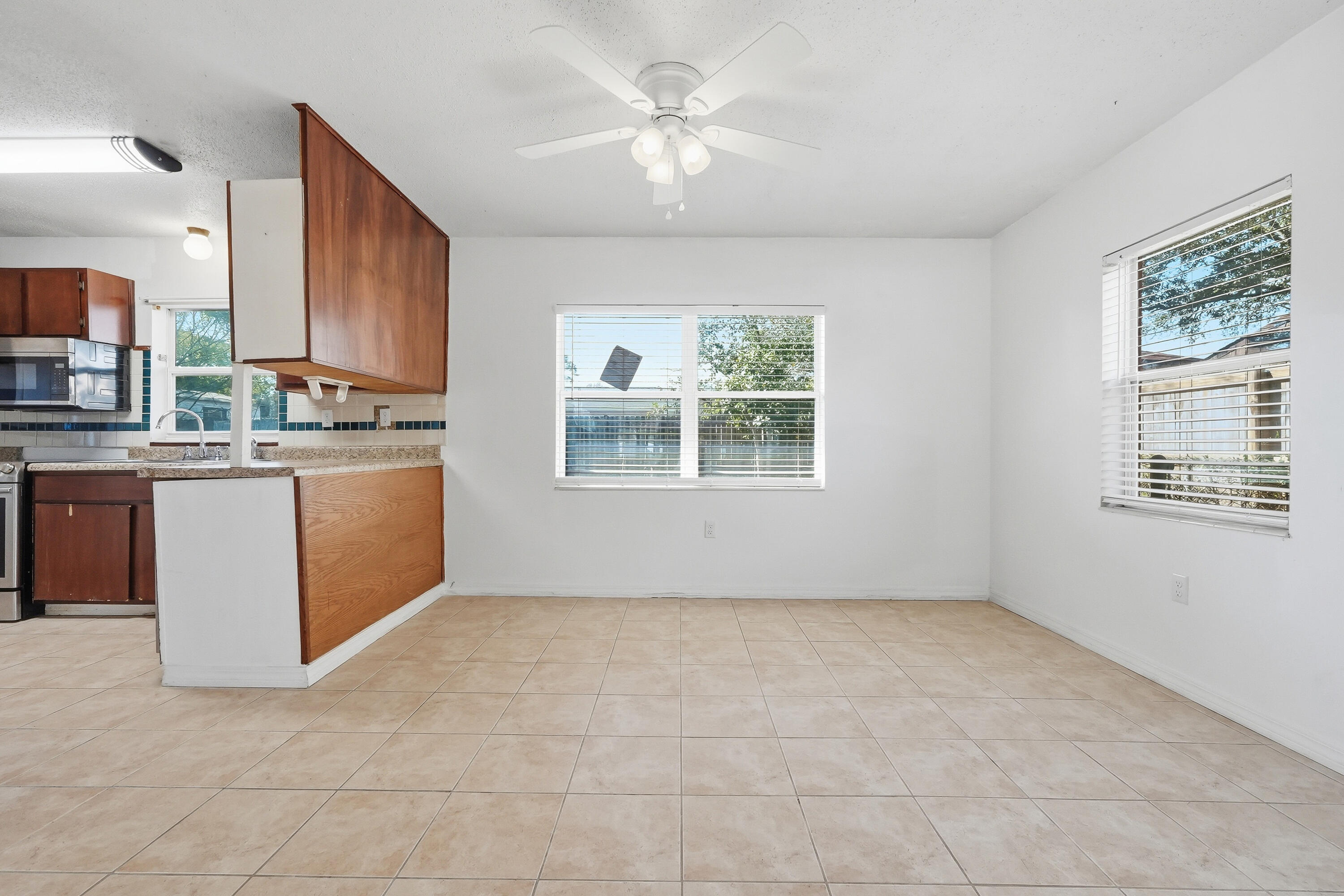 63 Oak Lane Shalimar, FL 32579 - Photo 8 of 42 a kitchen with stainless steel appliances granite countertop a stove a sink dishwasher and a refrigerator