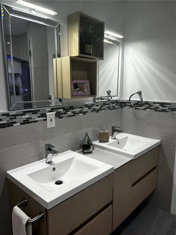 a bathroom with a shower and a sink