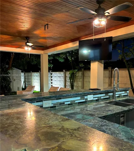 a kitchen with a stove and a sink