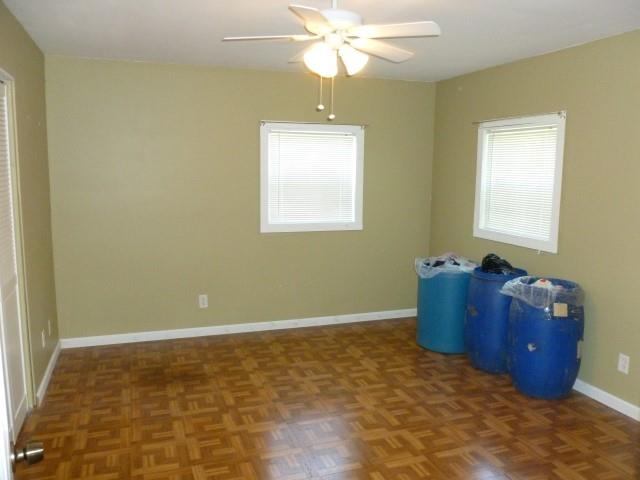 3109 Wayside Road Manchester, TN 37355 - Photo 14 of 18 a bedroom with a bed and a chandelier