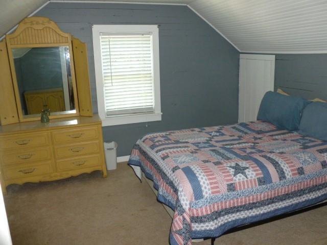 3109 Wayside Road Manchester, TN 37355 - Photo 8 of 18 a bedroom with a bed and a mirror