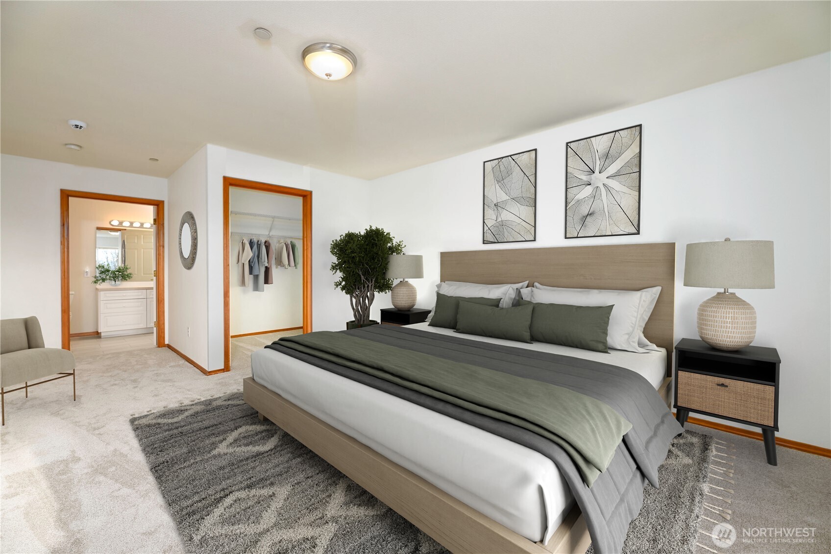 509 1st Street, Unit 104 Snohomish, WA 98290 - Photo 11 of 33 a bedroom with a bed and wooden floor