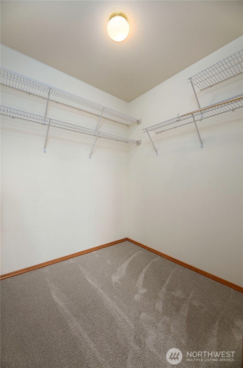 509 1st Street, Unit 104 Snohomish, WA 98290 - Photo 13 of 33 a view of a room with racks on the wall
