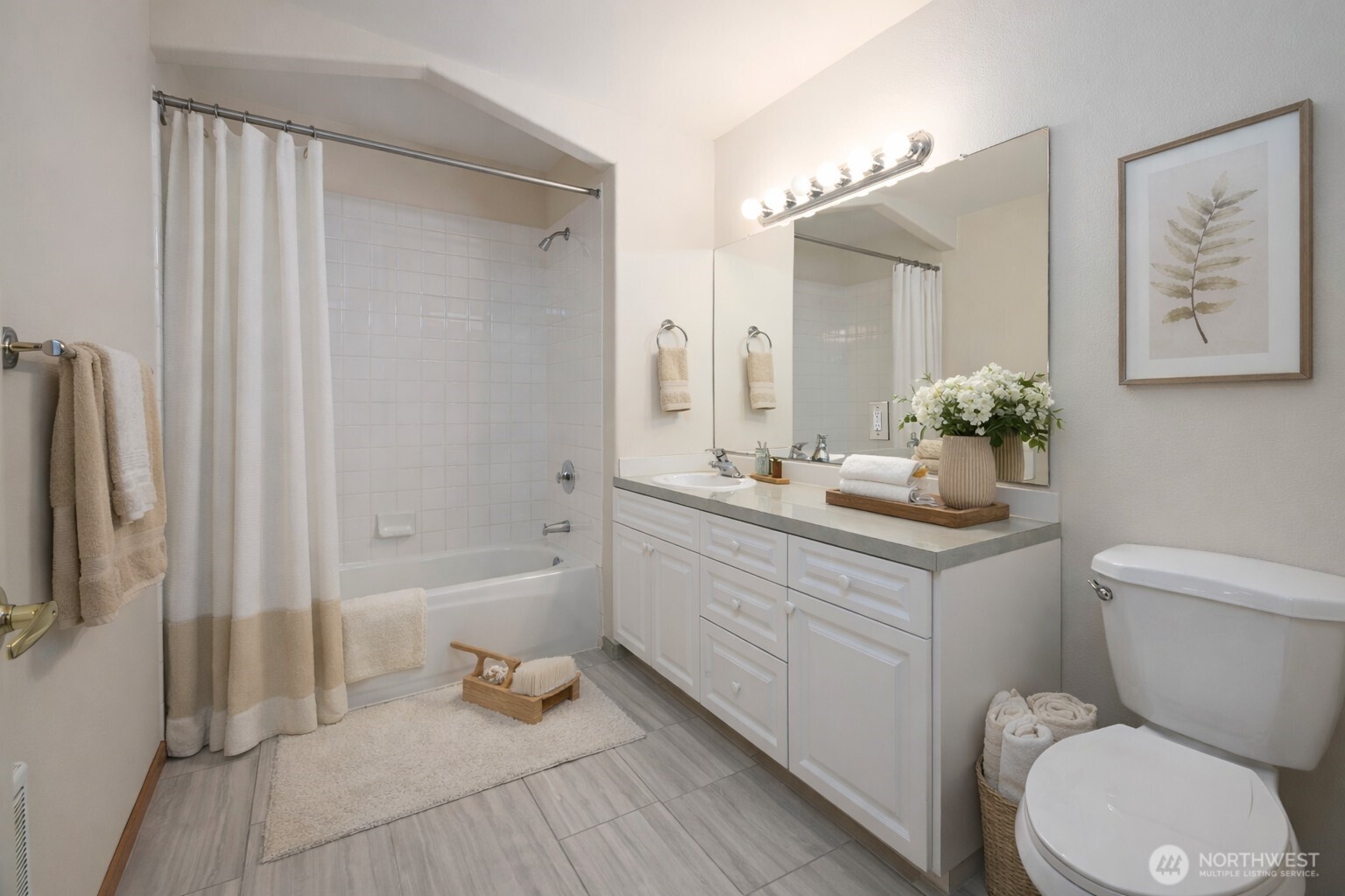 509 1st Street, Unit 104 Snohomish, WA 98290 - Photo 18 of 33 a bathroom with a sink a toilet and shower