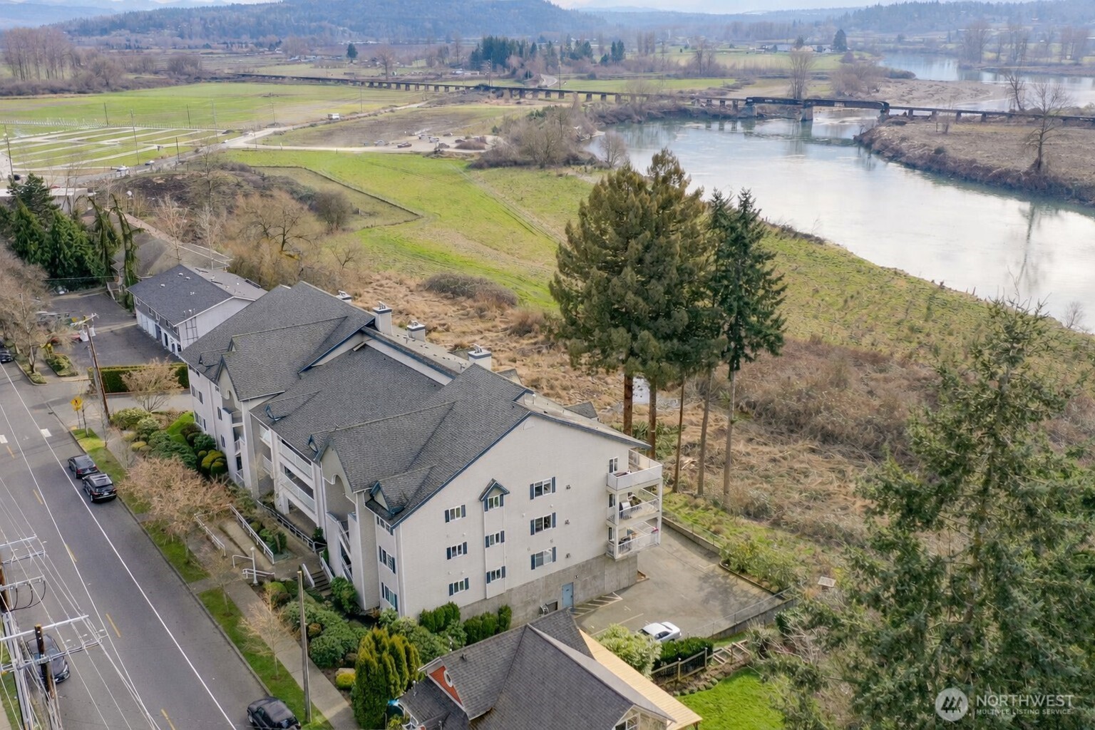 509 1st Street, Unit 104 Snohomish, WA 98290 - Photo 2 of 33 an aerial view of ocean with residential house with outdoor space