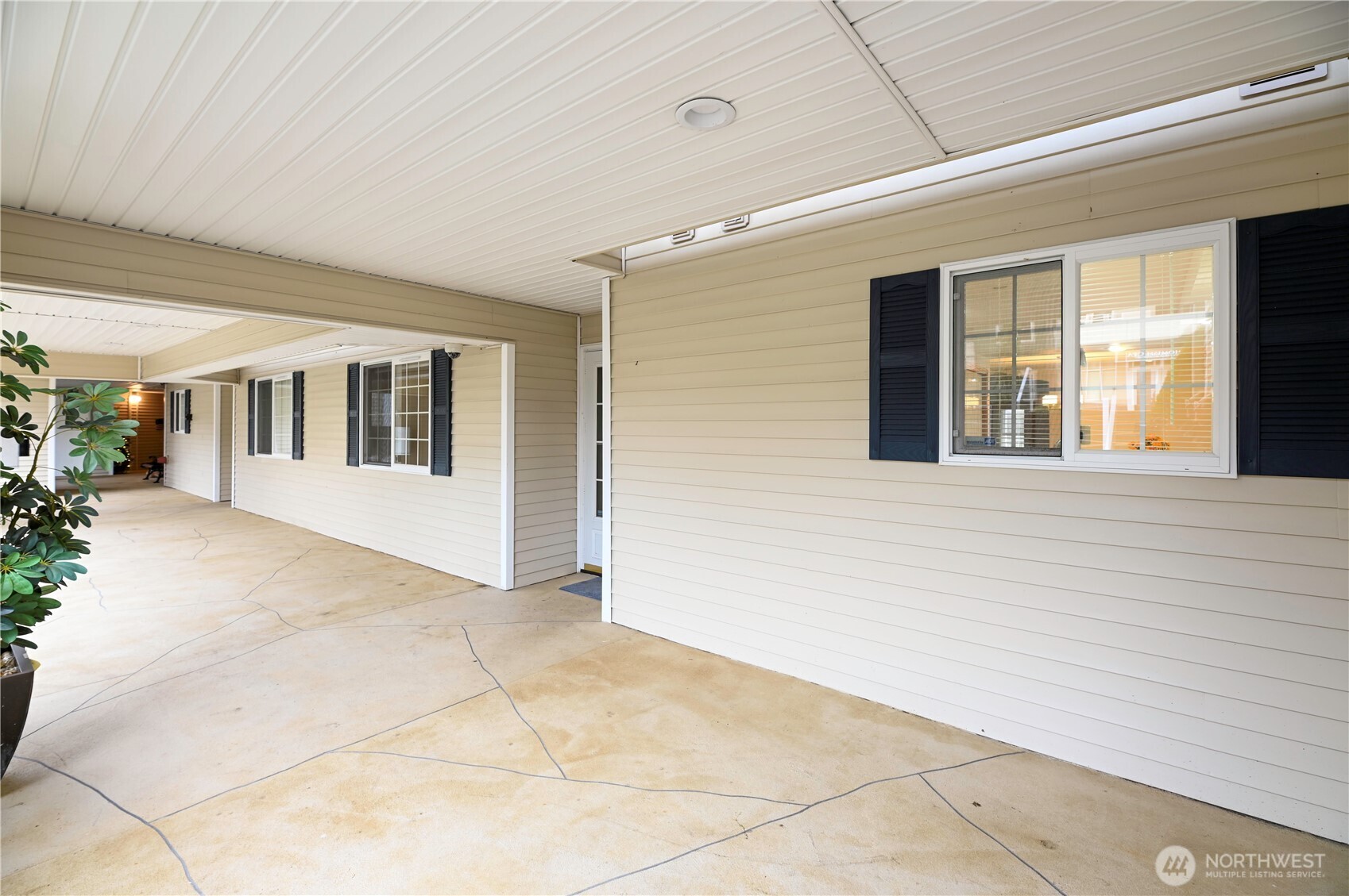 509 1st Street, Unit 104 Snohomish, WA 98290 - Photo 3 of 33 a view of a porch with wooden floor and fence
