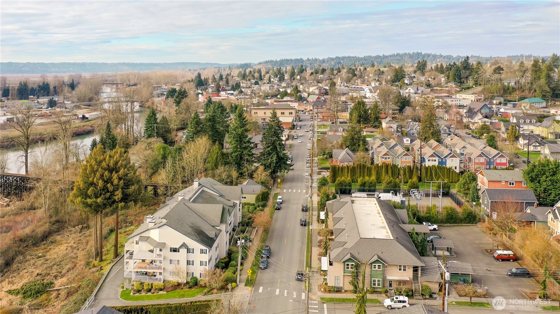 509 1st Street, Unit 104 Snohomish, WA 98290 - Photo 32 of 33 an aerial view of residential building with parking space