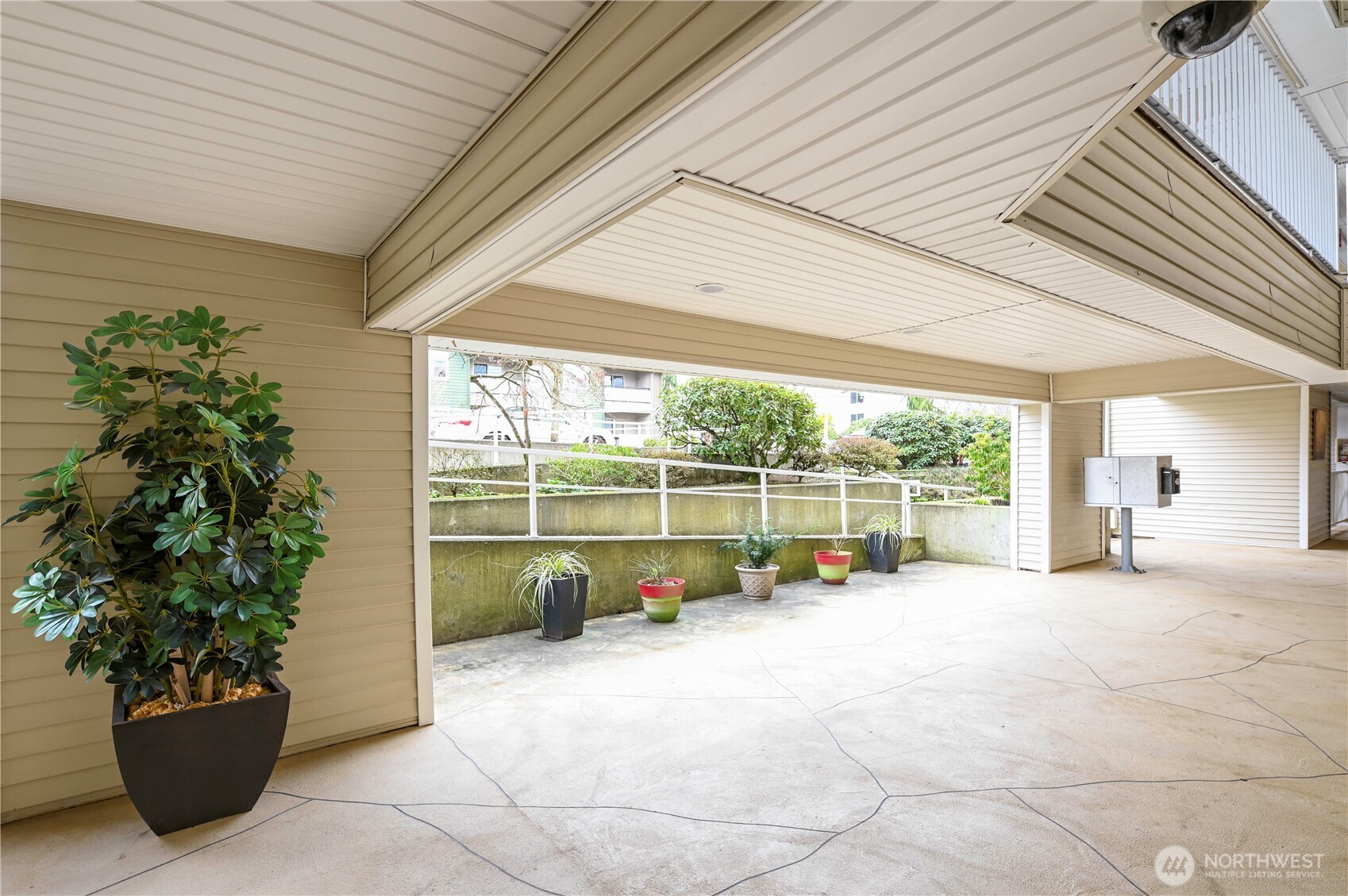 509 1st Street, Unit 104 Snohomish, WA 98290 - Photo 4 of 33 a view of a backyard with plants and a potted plant