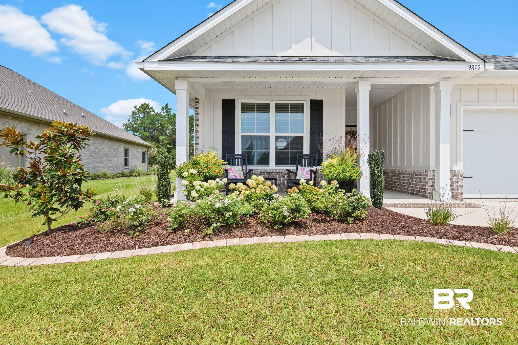 9815 Lakeview Drive Foley, AL 36535 - Photo 13 of 100 View of front of house with a front lawn, covered porch, and a garage