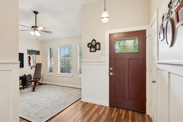 a view of livingroom with hardwood floor and a ceiling fan
