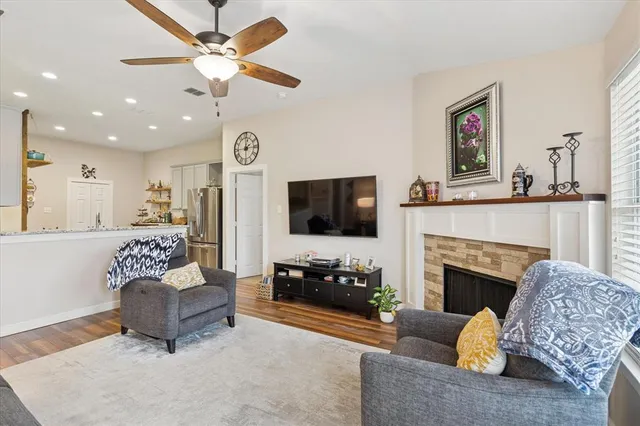 a living room with furniture and a fireplace
