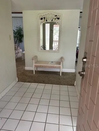 a bathroom with a sink a mirror and window