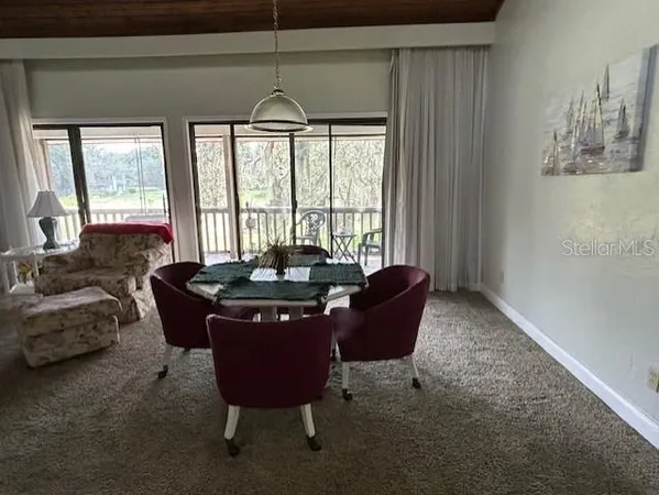 a bedroom with furniture and a flat screen tv