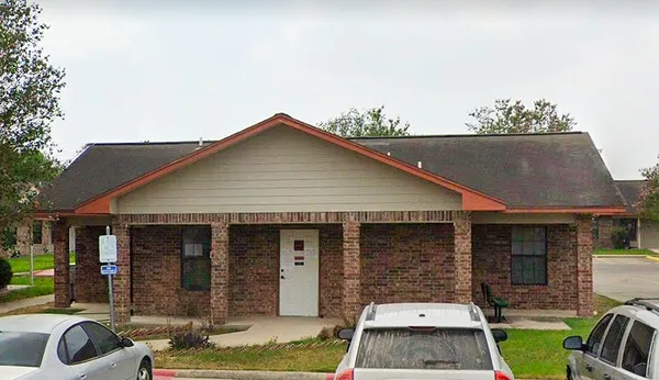 a front view of a house with parking space