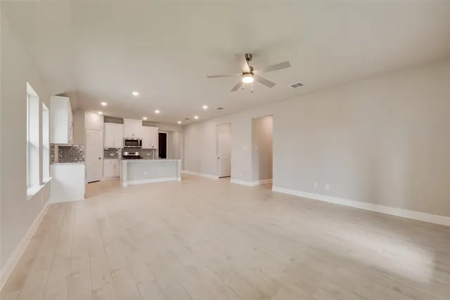 a view of a kitchen with a sink and a microwave