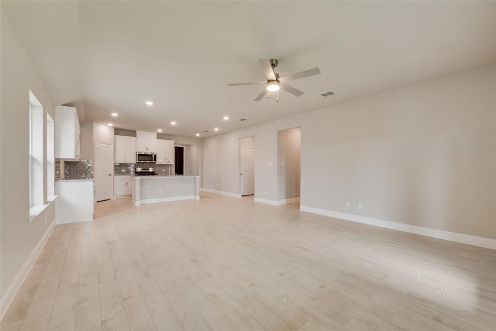 3206 Ferrero Lane Princeton, TX 75407 - Photo 15 of 29 a view of a kitchen with a sink and a microwave