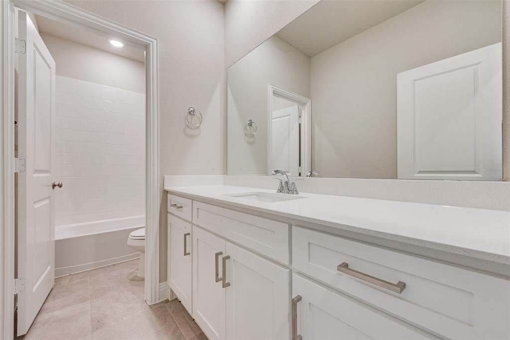 3206 Ferrero Lane Princeton, TX 75407 - Photo 22 of 29 a bathroom with a sink and a bathtub