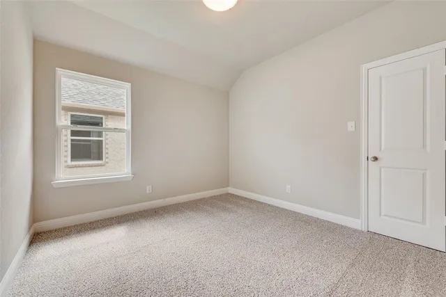 a view of empty room with windows