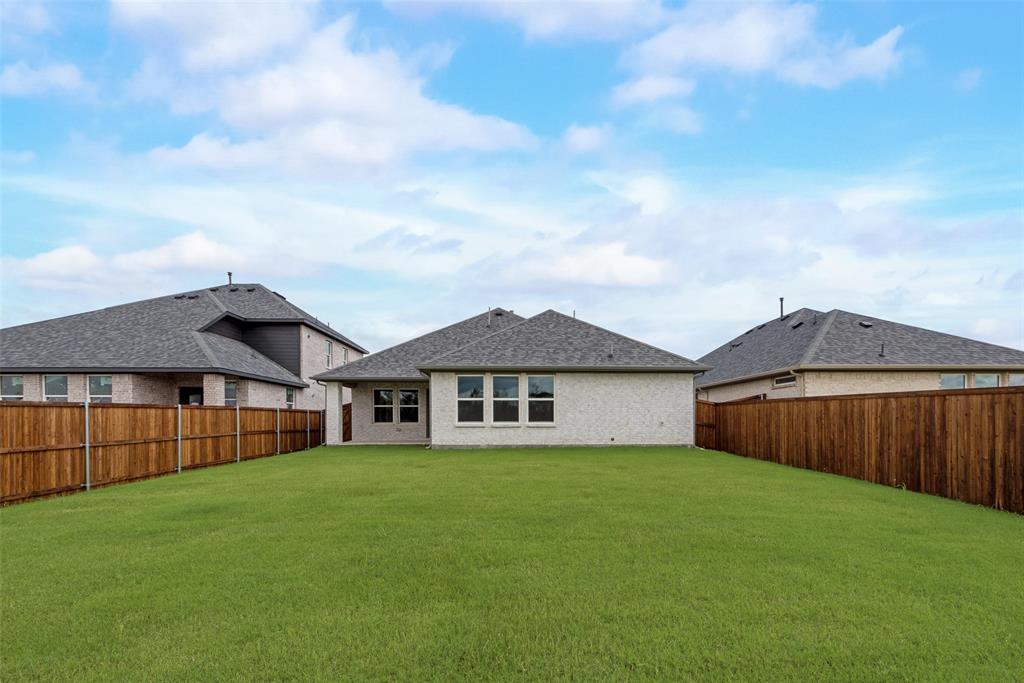 3206 Ferrero Lane Princeton, TX 75407 - Photo 28 of 29 a view of a house with a garden