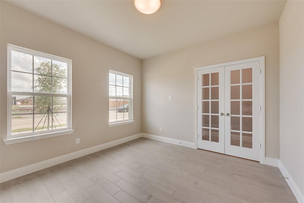 3206 Ferrero Lane Princeton, TX 75407 - Photo 7 of 29 an empty room with windows