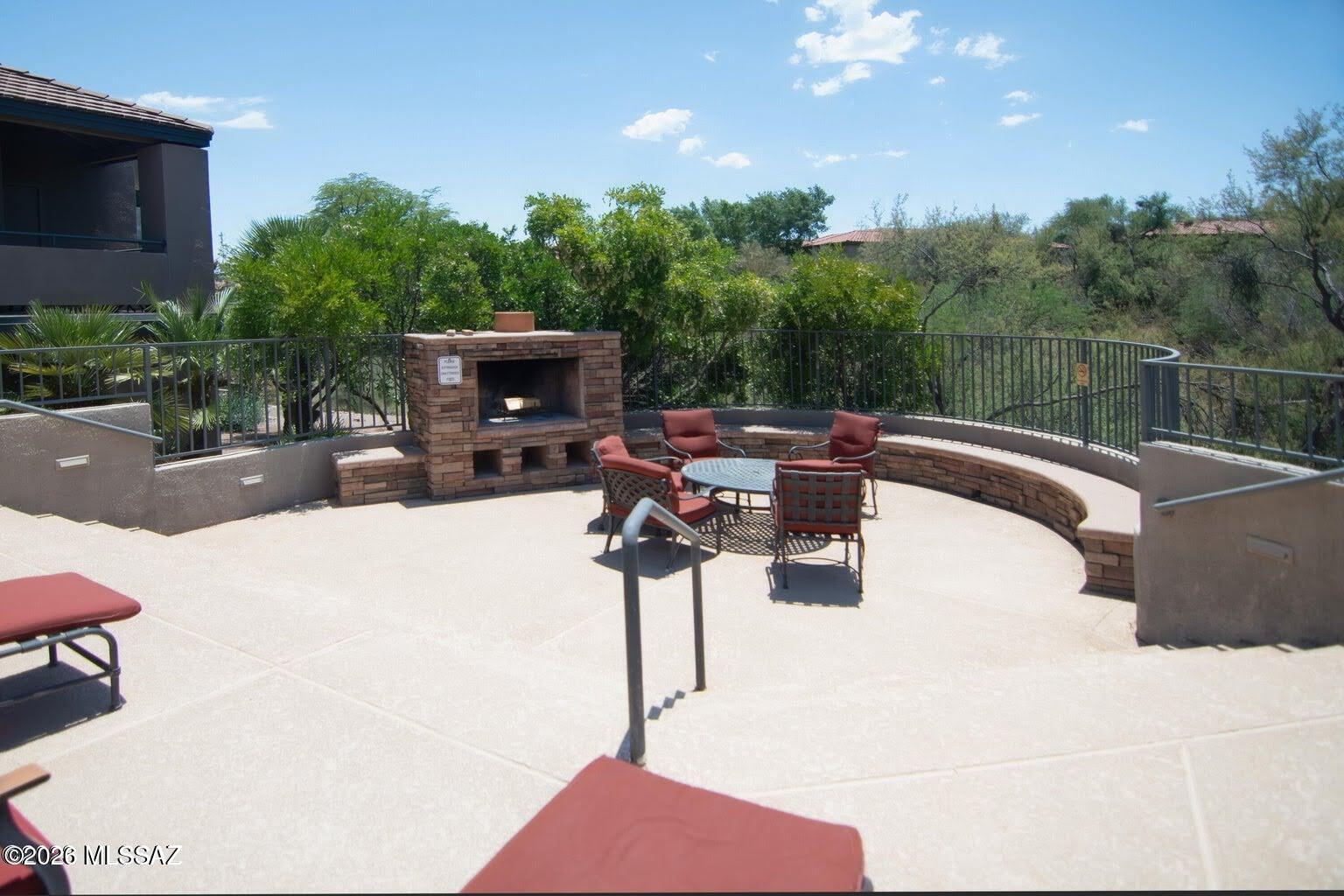 5855 North Kolb Road, Unit 11106 Tucson, AZ 85750 - Photo 35 of 36 a swimming pool with outdoor seating and yard