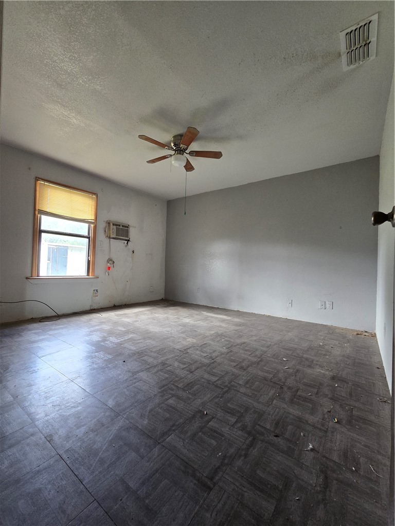 305 East Laredo Street Freer, TX 78357 - Photo 19 of 19 a view of a livingroom with a ceiling fan and window