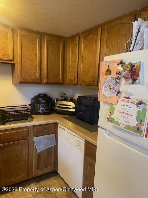 773 West 24th Street Rifle, CO 81650 - Photo 19 of 20 a kitchen with a stove and a refrigerator