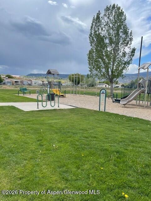773 West 24th Street Rifle, CO 81650 - Photo 5 of 20 a view of a swimming pool with lawn chairs and a big yard