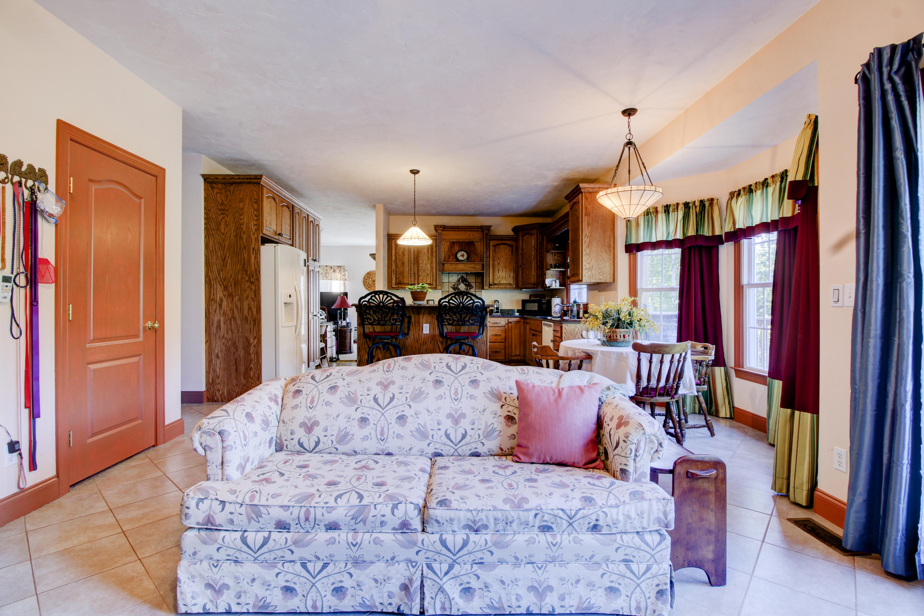 4020 Hatchett Road Penhook, VA 24137 - Photo 16 of 64 a living room with furniture a fireplace and a large window