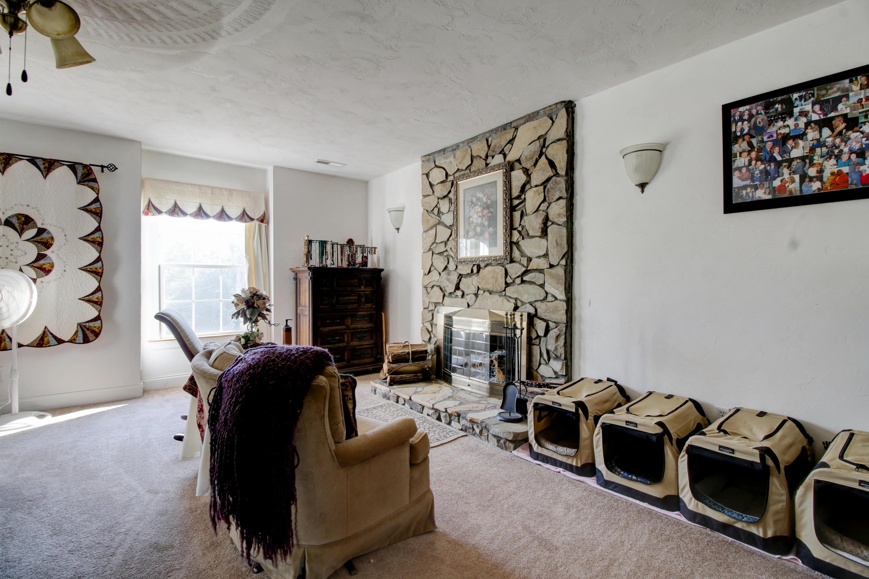 4020 Hatchett Road Penhook, VA 24137 - Photo 20 of 64 a living room with furniture a flat screen tv and a fireplace