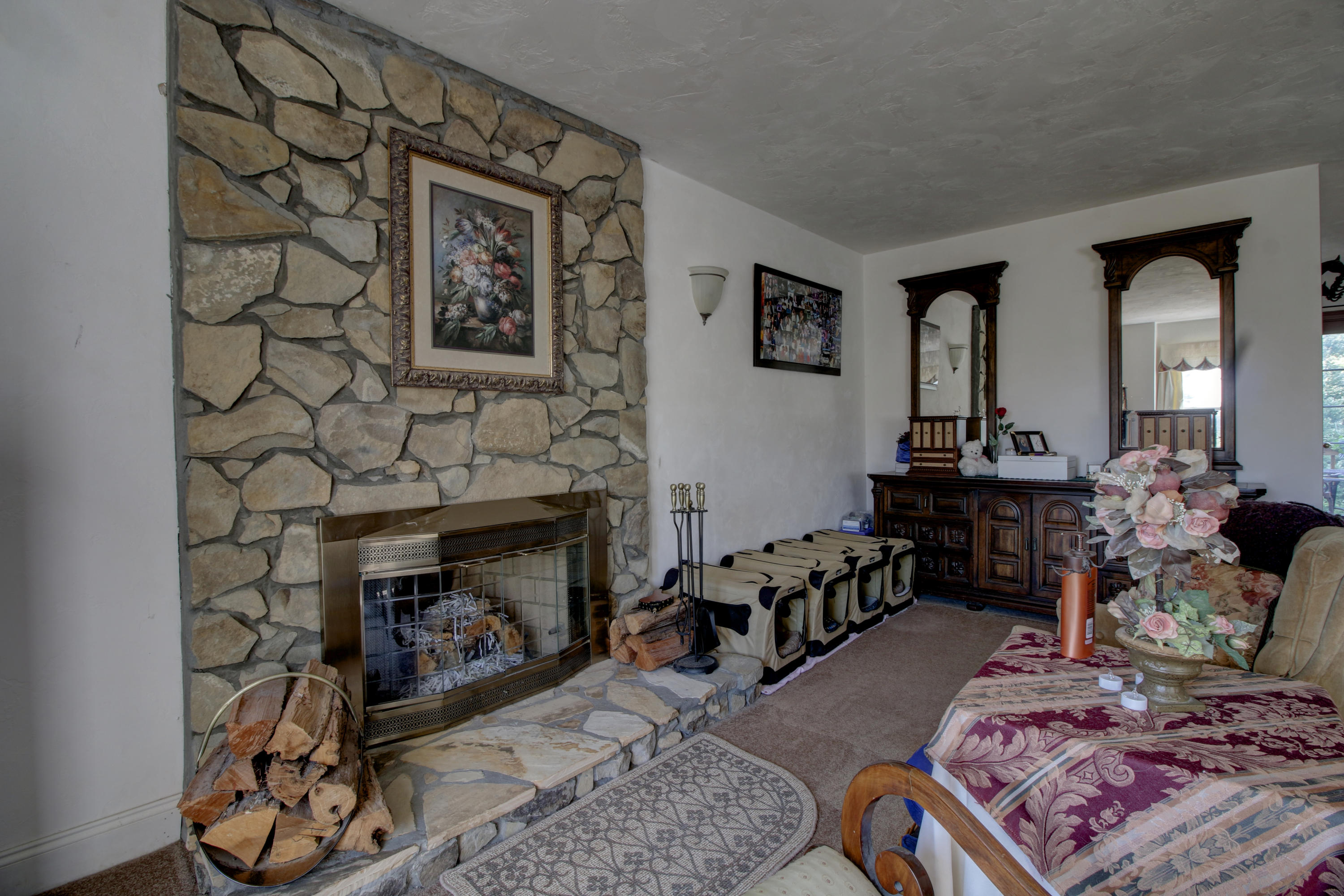 4020 Hatchett Road Penhook, VA 24137 - Photo 21 of 64 a living room with furniture and a fireplace
