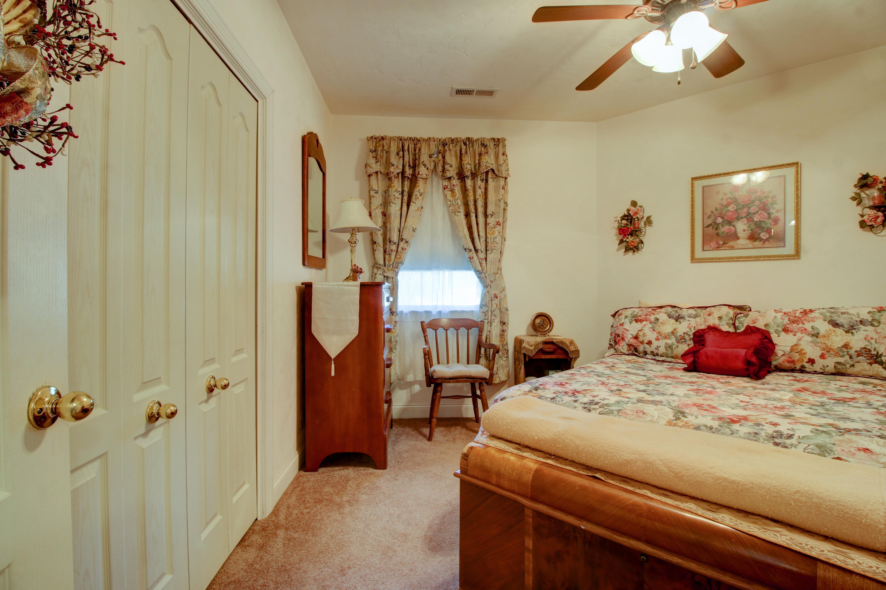 4020 Hatchett Road Penhook, VA 24137 - Photo 26 of 64 a bedroom with a bed and a chandelier