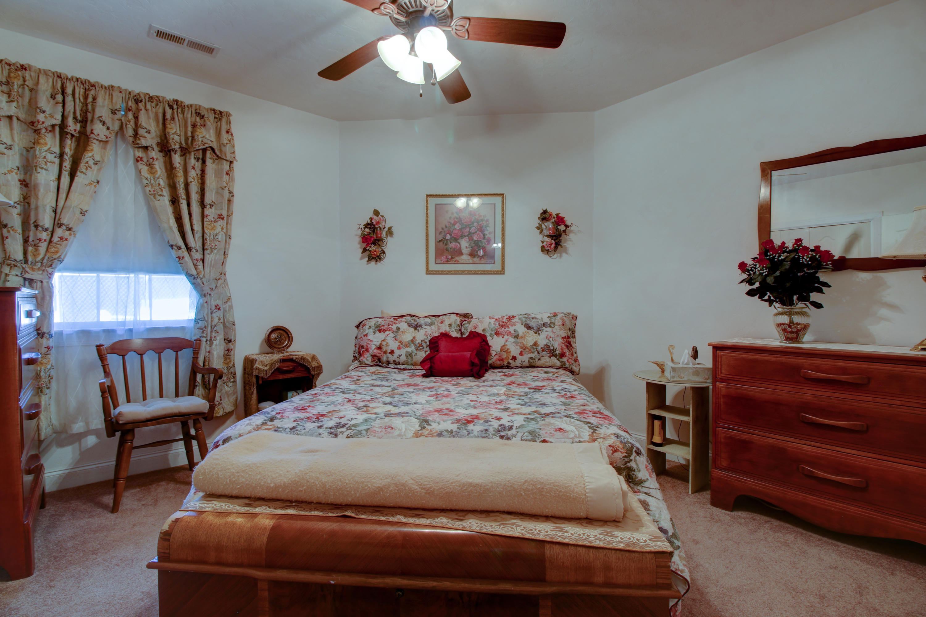 4020 Hatchett Road Penhook, VA 24137 - Photo 27 of 64 a bedroom with a bed and a chandelier
