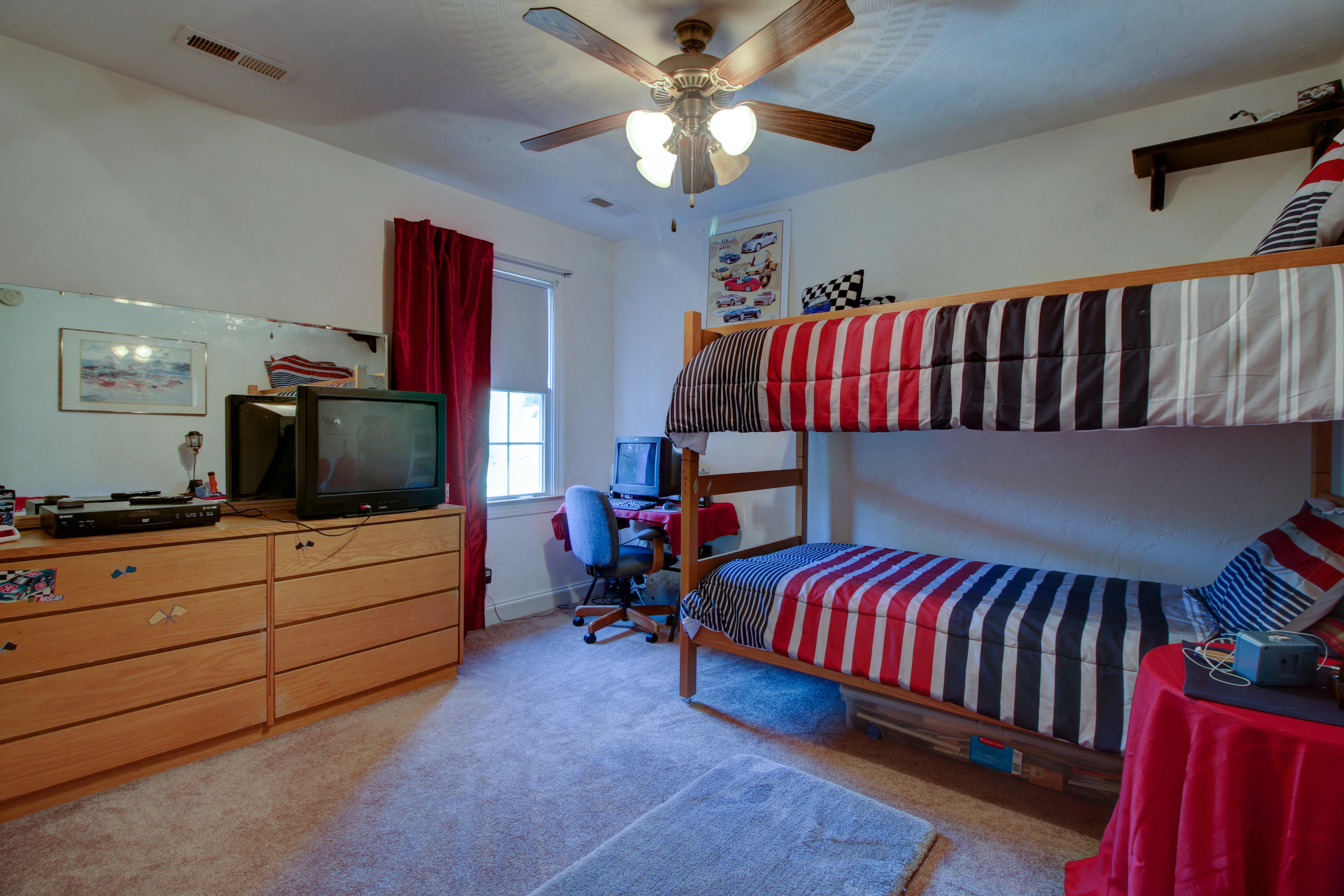 4020 Hatchett Road Penhook, VA 24137 - Photo 29 of 64 a bedroom with furniture and a flat screen tv
